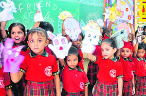 Children hold puppets during a programme at Tribune Model School, Sector 29, in Chandigarh on Saturday.