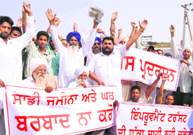 A file photo of villagers protesting against acquisition in Punjab.