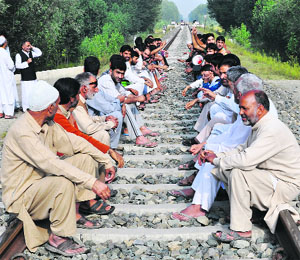People block a railway track in Gulbagh village in Pulwama district to protest against Zubin Mehtas concert on a call given by Hurriyat (G) chairman Syed Ali Shah Geelani on Saturday.