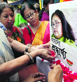 Members of the BJP Mahila Morcha pay tributes to slain writer Sushmita Banerjee in Kolkata on Saturday. 