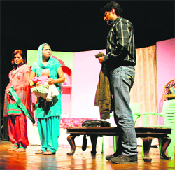 Artists perform in the play "Khu Bolda Hai" in Amritsar.