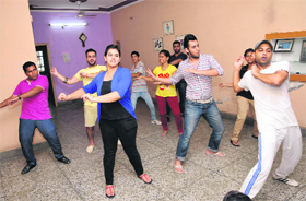 Children of the Arora family take dance lessons from a professional choreographer (in the foreground), Suresh Dagra, in Bathinda.