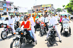 Members of the unaided schools union stage a motorcycle protest rally on Sunday.
