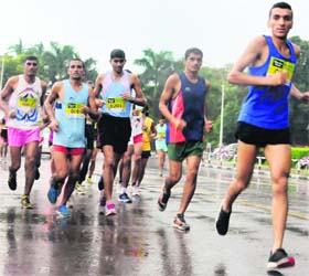 Athletes take part in a marathon which was flagged off at the Sukhna Lake in Chandigarh on Sunday