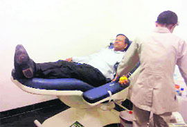 A donor donates blood at a camp organised by Making A difference (MAD) in Dehradun on Sunday. 