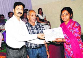 DC Devesh Kumar felicitates a woman at a function in Mandi on Sunday