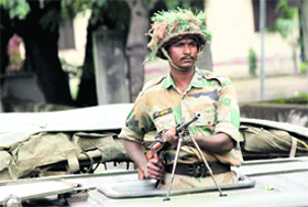 An Army personnel during a flag march in Muzaffarnagar on Sunday. 