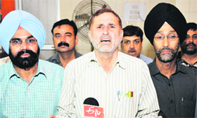 Members of Employees Joint Consultative Committee address mediapersons in Jammu on Sunday.
