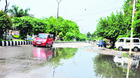 A road waterlogged due to heavy rain in the morning hours in Jammu on Sunday.