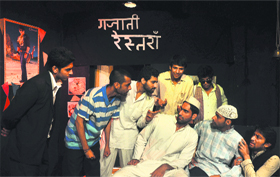 Artistes perform a play 'Sabse Bada Aadmi at Natrang Theatre in Jammu on Sunday.