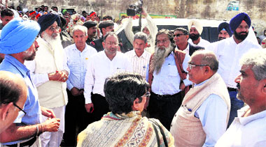 Chief Minister Parkash Singh Badal (second from left) and Revenue Minister Bikram Majithia (second from right) with the members of the 14th Finance Commission during a visit to the flood-affected areas in Muktsar on Sunday.