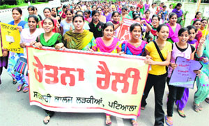 NSS volunteers hold an awareness rally on World Literacy Day in Patiala on Sunday. 
