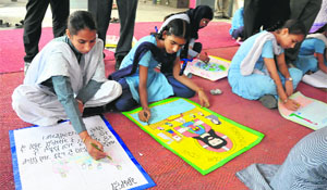 Students take part in a poster-making competition held recently at Government Girls Senior Secondary School situated on the Mall road in Bathinda.