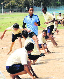 Players in action during a match of the Inter-College Kho-Kho Tournament at Panjab University on Monday. 
