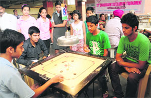 A carrom match in progress at St Stephens School, Sector 45, in Chandigarh on Monday.