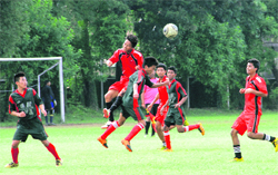 A match in progress during a football tournament in Dehradun on Monday. 