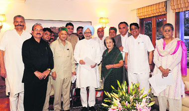Prime Minister Manmohan Singh with Chief Minister Virbhadra Singh and his colleagues in New Delhi on Monday. 