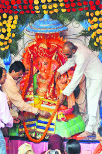 Devotees offer prayers on Ganesh Chaturthi festival in Shimla on Monday. 