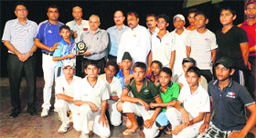 Sonepat Under-14 cricket team receives a trophy from Chander Shekhar, Director-General, Secondary Education Department, Haryana, during the closing ceremony of the 48th Haryana State School Sports meet at the sports school, Rai.