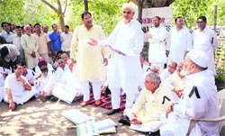 INLD MLAs hold a parallel session near the Vidhan Sabha in Chandigarh on Monday. 