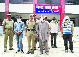 The accused in police custody in Rajouri on Monday