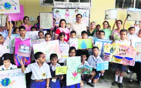 Students of MHAC School, Nagbani, show their paintings in Jammu on Monday