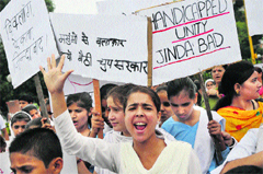 Students with impaired hearing hold a protest on Monday against the rape of five mentally challenged girls in Jammu. Tribune photo: Inderjeet Singh