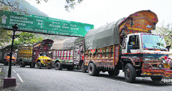 A file photograph of trucks from Muzaffarabad in Pakistan-occupied Kashmir near the LoC at Kaman Post in Uri in Baramulla district. Tribune photo: Amin War