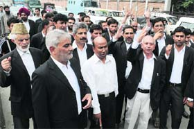 Members of the Kashmir High Court Bar Association protest in Srinagar on Monday against killing of four civilians in firing by CRPF personnel in south Kashmirs Shopian district