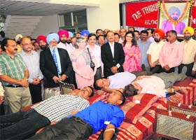 Tribune employees donate blood on the 115th death anniversary of The Tribune Trust founder Sardar Dyal Singh Majithia in Chandigarh on Monday