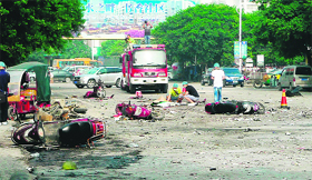 Damaged motorbikes and debris at the blast site in Guilin on Monday.