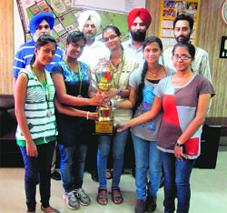 Members of the Giani Zail Singh Punjab Technical University Campus girls team along with the trophy in Bathinda on Tuesday. 
