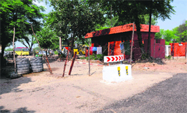 A portion of the road that has been encroached on by the CRPF at the Mullanpur barrier.