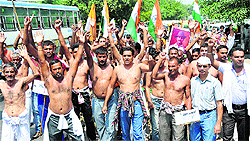 Residents of Kalram and adjoining villages take out a protest march in Karnal on Tuesday