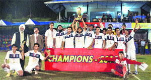The YPS Mohali team with the third All-India Sant Singh Memorial Soccer trophy at Pinegrove School in Dharampur.