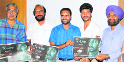 Head of the Department of Journalism, Kamlesh Duggal, (extreme right) with his students and staff at the release of posters of an upcoming short film at GNDU Regional Campus in Jalandhar on Tuesday. 
