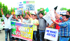 Activists of the Jammu Kashmir Democratic Front protest against incidents of rape, in Jammu on Tuesday.