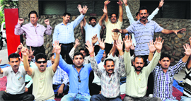 Members of the Joint Consultative Committee of the J&K Government Employees Association protest in Jammu on Tuesday.