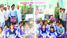 Officers of the Rashtriya Rifles with the students of Government School, Jhanger, in Rajouri on Tuesday.