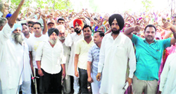 Mukerian residents protest against the proposed thermal plant in their area. A Tribune photo