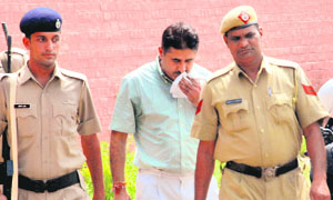 RK Chaudhary being produced in the district courts in Panchkula on Wednesday.