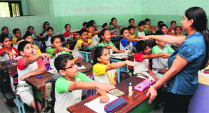 Students take an oath for recycling tetra waste products at Saupin's School in Sector 32, Chandigarh, on Wednesday.