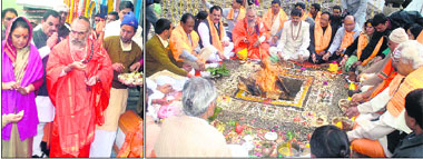 Rawal Bheema Shankar Lingam along with state minister Harak Singh Rawat, Kedarnath legislator Shaila Rani Rawat and temple committee chairman Ganesh Godiyal at Kedarnath temple; (right) a yajna under way at the temple on Wednesday.
