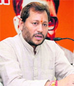 State BJP chief Teerath Singh Rawat addresses mediapersons in Dehradun on Wednesday. 