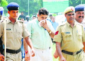 Doon MLA Ram Kumar Chaudhary being produced in the District Court in Panchkula on Wednesday