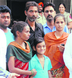 The 12-year-old girl with her parents in Jalandhar on Wednesday. The victim's custody was secured through court orders. A Tribune Photograph