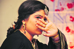 Actress Neha Lahotra performs in the play Main Damini Bol Rahi Hun in Jammu on Wednesday. 