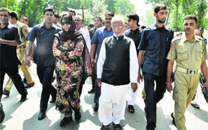 PDP president Mehbooba Mufti along with party leaders being detained by the police at District Police Lines in Pulwama on Wednesday.