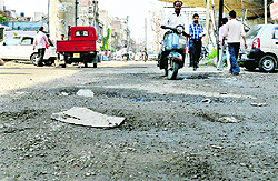 Potholed roads near Lakkar Pul and near DIG office in Civil Lines, Ludhiana