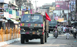Security personnel keep vigil during relaxed hours of curfew in the riot-hit Muzaffarnagar on Wednesday. 